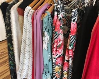 assorted blouses, skirts, cardigans, sweaters, dresses all throughout the store