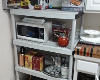 small appliances in the box, microwave, wine glasses new in the box