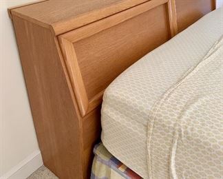 There is a spot on the top for an electrical cord so you can put a lamp up on the headboard