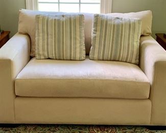 Item 50:  Crate & Barrel love seat with two custom Crate and Barrel pillows in pale blue, beige and ivory - 56.5" x 30" x 31" tall: $425