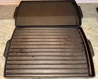 Item 248:  (2) Cast iron griddles for gas stove: $65