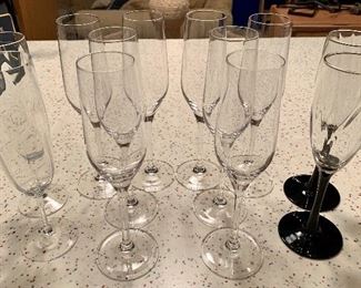 Item 216:  Lot of 12 Champagne flutes - the 8 glasses in the middle are marked Artland:  $40