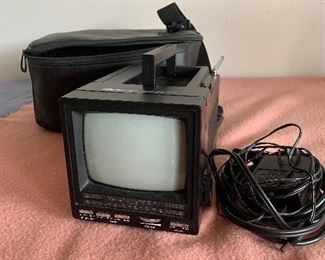 lot 5- little portable tv with case and power cord $6