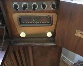 Front of vintage radio in cabinet