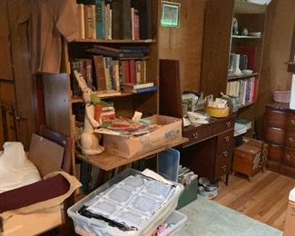 Loads of books, book cases, sewing machine, bins of fabric