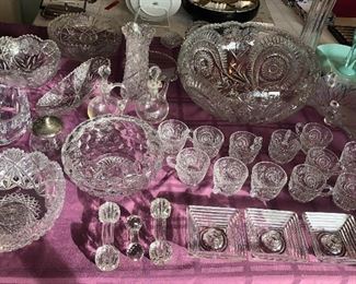 Old cut crystal bowls, vase & cruets, punch bowl set w/ 12 cups, knife rests, Manhattan square candle holders, “Slewed Horseshoe” punch bowl set w/ 12 cups