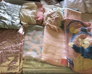 Vintage baby linens: satin comforters, knit & wool blankets, chenille bedspread with teddy bear & balloons