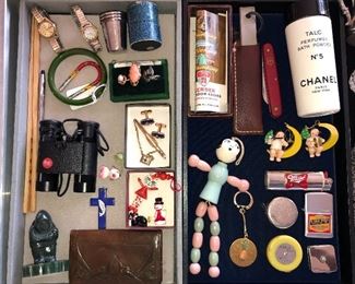 Case items: German metal cup set w/ case, gold pearl ring, gold cameo ring, Wallace sterling “Romance of the Seas” ring, Masonic cufflinks & tie clip, Leitz Trinovid 8x20C binoculars, carved green jade Eskimo, Roycroft (!) tooled leather coin purse, Gerber steel w/ scabbard & box, Chanel No. 5 talc, wooden crib toy, Wendt Kuhn (?) moon ornaments, advertising tape measures