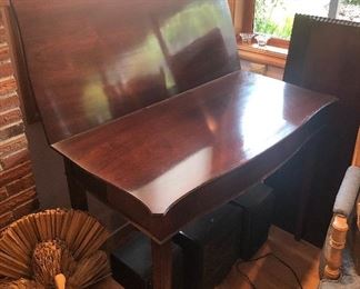 Turns into a dining table - top half of table flips open, lays flat & then slides forward along base.  Table base separates so you can add leaves to make table longer - includes three 12” leaves. Total length with all 3 leaves in place = 76”.