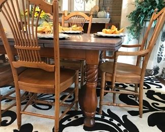 Extendable Dining Table with a grey wash finish and 6 fan-back chairs 