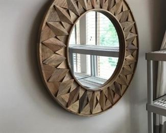 Sunburst Mirror - Natural wood peaks radiate from a circular mirror 