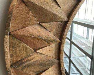 Sunburst Mirror - Natural wood peaks radiate from a circular mirror 