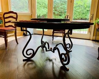 Detail: Base of Creative Metal & Wood (North Carolina) handcrafted wrought iron and wood round dining table.