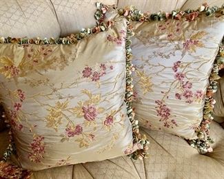 $250 Pair B; Ebanista Embroidered silk fabric pillows with tassel trim. Approx 18" square.