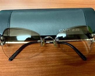 $595 Cartier sunglasses and case One pair