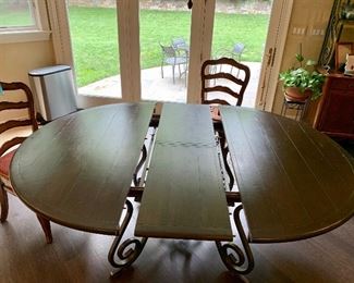 Detail: Wrought iron base breakfast table - shown with self storing 16" leaf