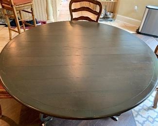 Detail: French Country wooden topped wrought iron base breakfast table. 60" diameter