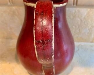 Detail: Pottery Barn Ceramic Red glazed pitcher (repaired)