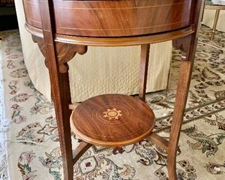 $325 Round inlayed side table with 4 drawers. 28.25"H x 21.25"D