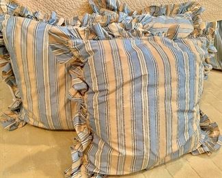 $150 for three blue and yellow striped down-filled pillows 24" square
