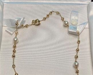 $1,295 Triadra pearl necklace, approx 16". 18K and pearl station necklace. Gold chain enhanced with 5 dimodolo triad pearls, each approx 7 mm.