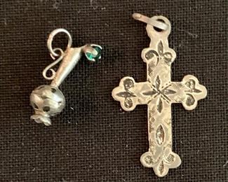 $20 Lot of 2 Sterling silver charms.  Embellished urn (left) and etched cross (right - stamped 925)