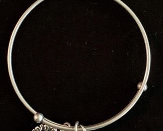 $20 Alex & Ani bracelet with three charms.