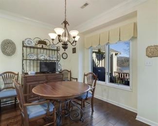 Ethan Allen table w/leaf, four chairs and baker's rack.