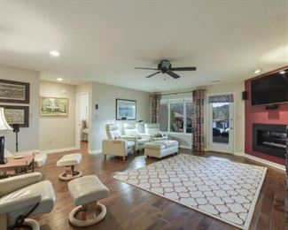 Stressless three-seat reclining sofa and matching ottoman/coffee table.  Excellent condition.