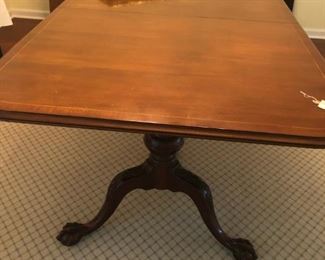 Double pedestal table with 2 leaves.  Fully extended seats 12.  Comes with custom pads.