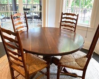 4ft round table with 4 rush seat ladder-back chairs
