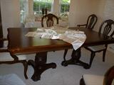 table has 2 leaves and custom table pads