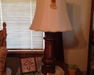 Side table, more hand croucheted doily, plaque with stand, candle and framed and matted print