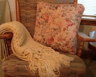 One of two matching gliders, hand croucheted Afghan and one of many decorative pillows