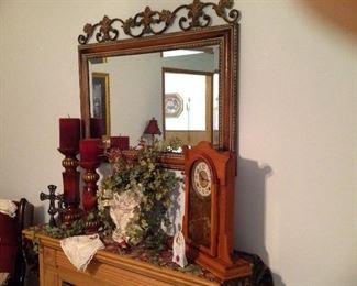 Decorative mirror, antique oak mantel clock (has the key), large candle holders, crosses, hankie, floral