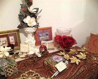 Wind chimes, cherub planter and magnolia arrangement, ruby rose bowl, metal leaf wall art