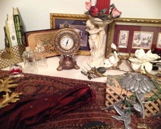 Decorative clock, fleur de Lis bookends, vintage metal shelf, decorative leaves, cherub planter with florals and windchime