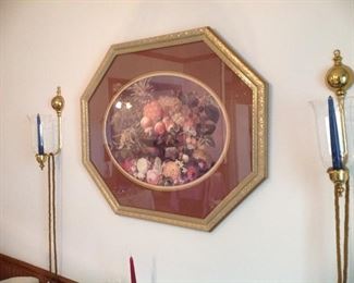 Framed and matted print, brass sconces with glass globes, beaded tassels
