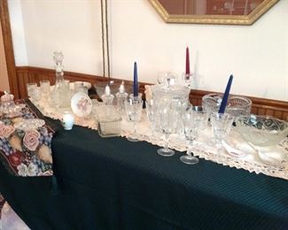 Table runners, battenburg tablerunners, crystal bowls, Wexford decanter and stems set, vintage candleholders, large crystal biscuit barrel with lid and more