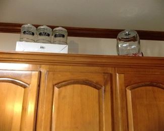 Glass with metal top canisters and cookie jar