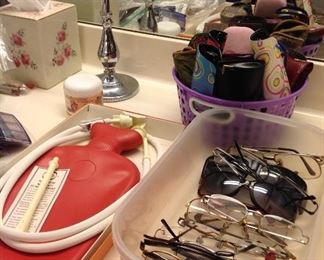 Vintage hot water bottle in original box, reading glasses