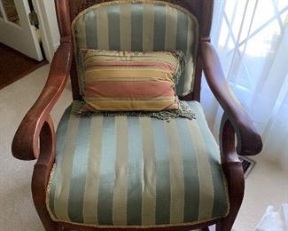 Large antique chair with silk upholstery