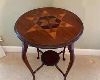 Inlaid table with damage
