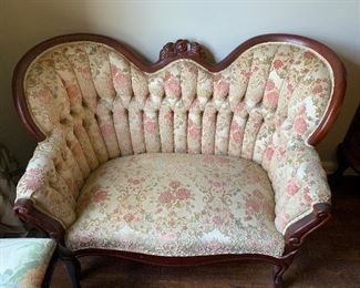 Small camel back love seat or settee