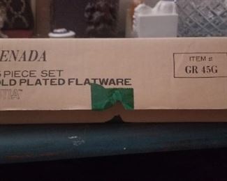 gold plated service for 6
new in box  $10
Please check terms and conditions
24