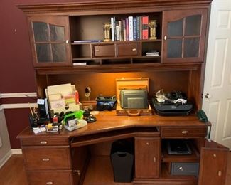 Desk includes key lock safe, pull out printer drawer, keyboard drawer, power strip drawer, etc.