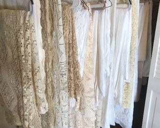 Assorted linen and lace tablecloths 