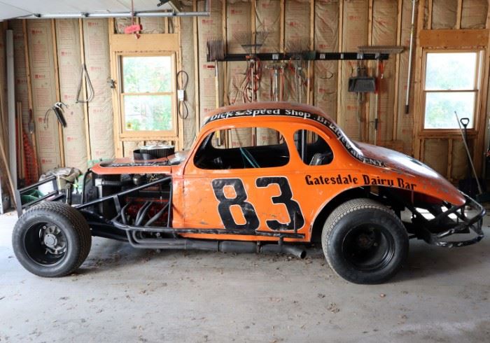 Lot 1: 1970s open wheel stock car from Rudy's Garage, New York. Built from a 1937 Chevy 5-window coupe body, a Mike Butler racing small block Chevy V-8 engine, 2BBL carburetor, manual transmission and 4 -wheel drum brakes. Winters Quick Change Rear End, Hoosier dirt track tires. Starts and runs well. Includes an extra set of dirt track Hoosiers and wheels in good condition. 