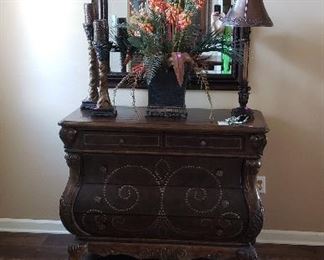 Bombay chest, mirror, lamp, candlesticks, floral arrangement, sisal rug.   Price of Bombay chest  $495