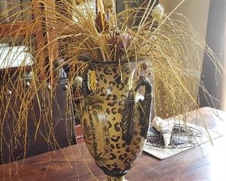 Animal print vase with floral arrangement